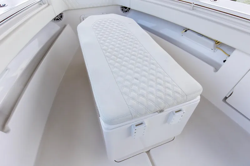  Yacht Photos Pics 2020 Invincible 39 Open Fisherman boat interior with cushioned seating and storage.