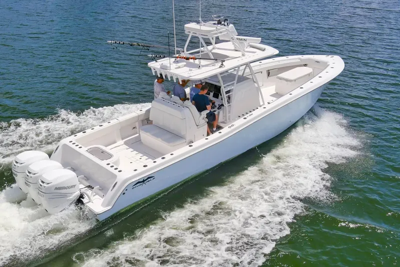  Yacht Photos Pics 2020 Invincible 39 Open Fisherman boat cruising on open water with multiple outboard engines.