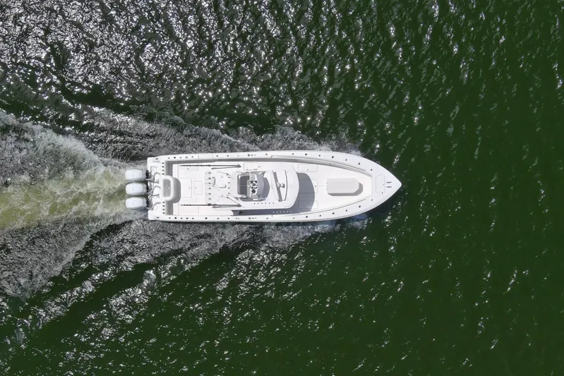  Yacht Photos Pics Aerial view of 2020 Invincible 39 Open Fisherman boat cruising on water.