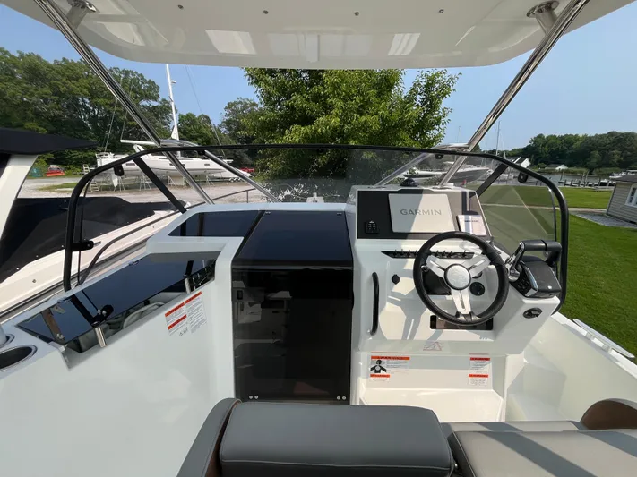  Yacht Photos Pics 2023 Beneteau Flyer 9 SUNdeck cockpit with steering wheel and Garmin display.