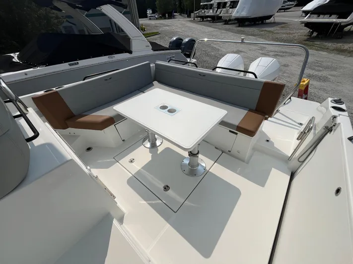  Yacht Photos Pics 2023 Beneteau Flyer 9 SUNdeck with spacious seating and table on deck.