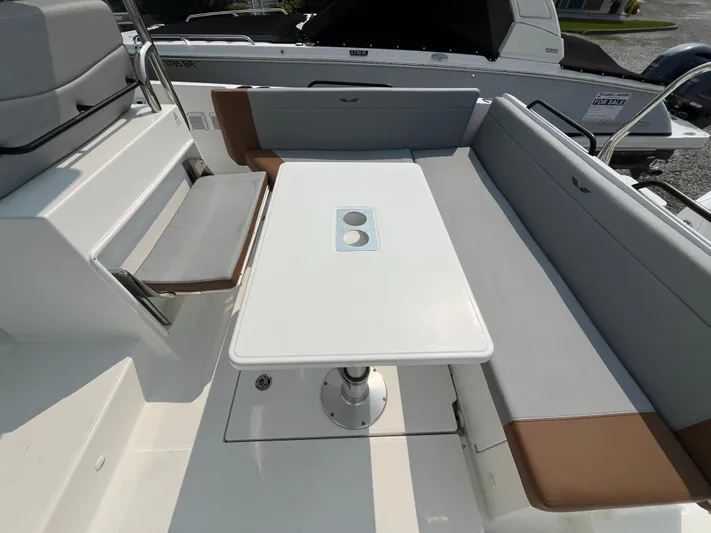  Yacht Photos Pics 2023 Beneteau Flyer 9 SUNdeck interior with seating and table setup.