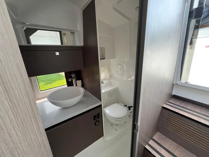  Yacht Photos Pics 2023 Beneteau Flyer 9 SUNdeck bathroom with modern sink and toilet.