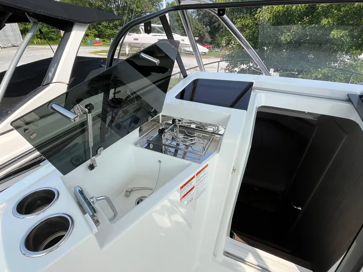  Yacht Photos Pics 2023 Beneteau Flyer 9 SUNdeck boat interior with sink, stove, and cup holders.