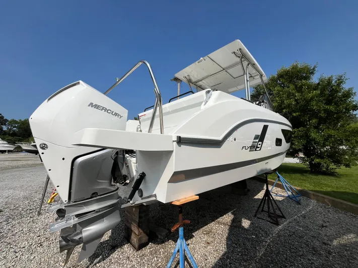  Yacht Photos Pics 2023 Beneteau Flyer 9 SUNdeck boat with Mercury engine on display outdoors.