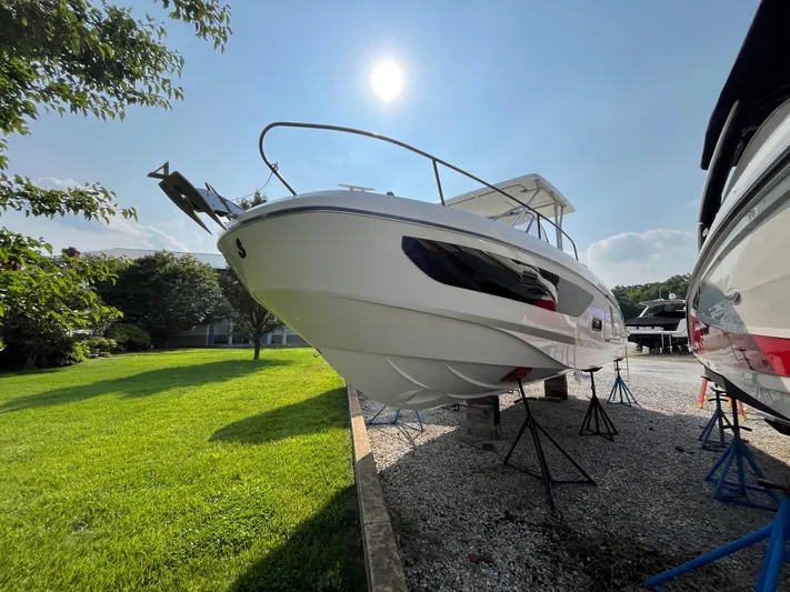  Yacht Photos Pics 2023 Beneteau Flyer 9 SUNdeck boat displayed outdoors on stands.