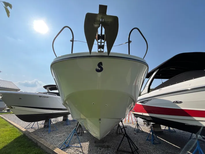  Yacht Photos Pics 2023 Beneteau Flyer 9 SUNdeck boat displayed outdoors under a clear sky.
