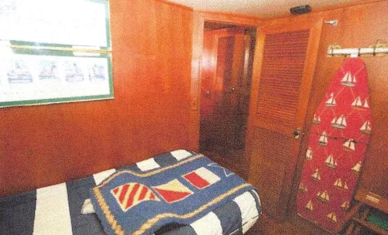 Wendy Lynn Yacht Photos Pics 1984 Ocean Alexander Flying Bridge Motor Yacht cabin with nautical-themed decor and wooden interior.