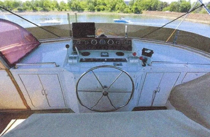 Wendy Lynn Yacht Photos Pics 1984 Ocean Alexander Flying Bridge Motor Yacht helm with steering wheel and control panel.