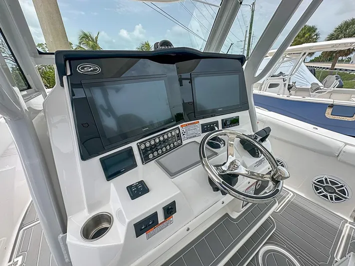  Yacht Photos Pics 2024 Sea Fox 328 Commander helm with dual screens and modern controls.