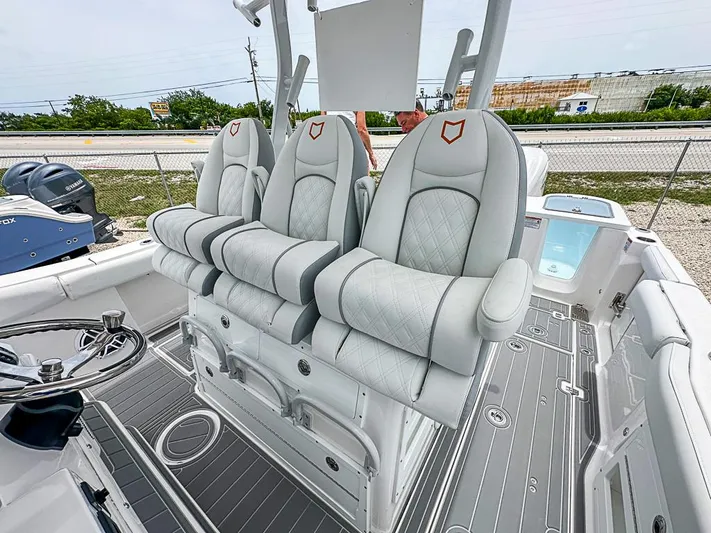  Yacht Photos Pics 2024 Sea Fox 328 Commander boat with luxurious seating and modern design.