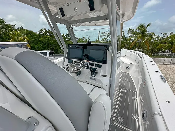  Yacht Photos Pics 2024 Sea Fox 328 Commander boat interior with modern dashboard and seating.