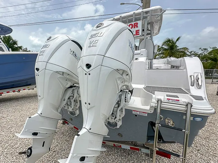  Yacht Photos Pics 2024 Sea Fox 328 Commander with twin outboard engines, displayed outdoors.