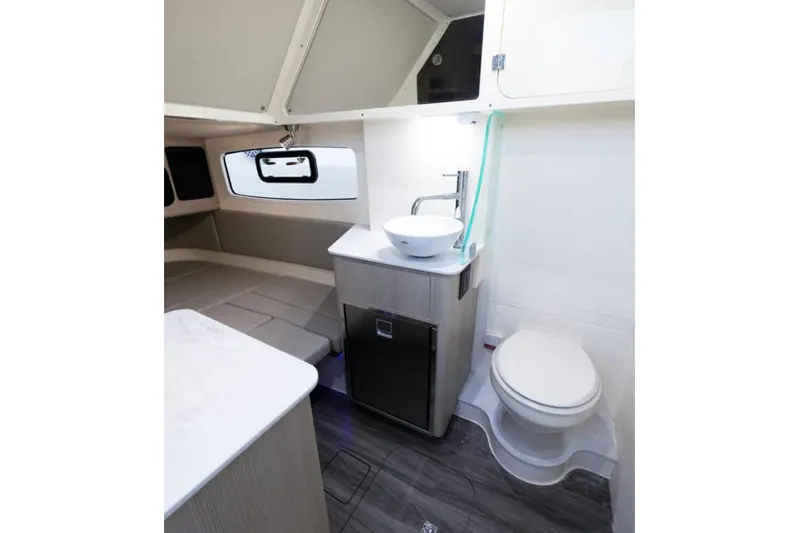  Yacht Photos Pics Manufacturer Provided Image: 2025 Scout 357 LXF cabin interior with modern bathroom and compact design.