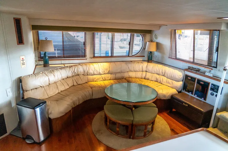 Jolly Roger II Yacht Photos Pics Luxurious 1997 Harbor Master Stolkraft yacht interior with plush seating and elegant decor.