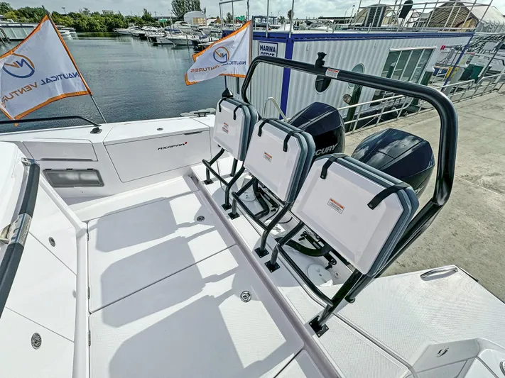  Yacht Photos Pics 2024 Axopar 37 Sun Top boat with triple Mercury engines docked at marina.