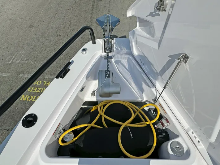  Yacht Photos Pics 2024 Axopar 37 Sun Top anchor compartment with yellow rope and storage.