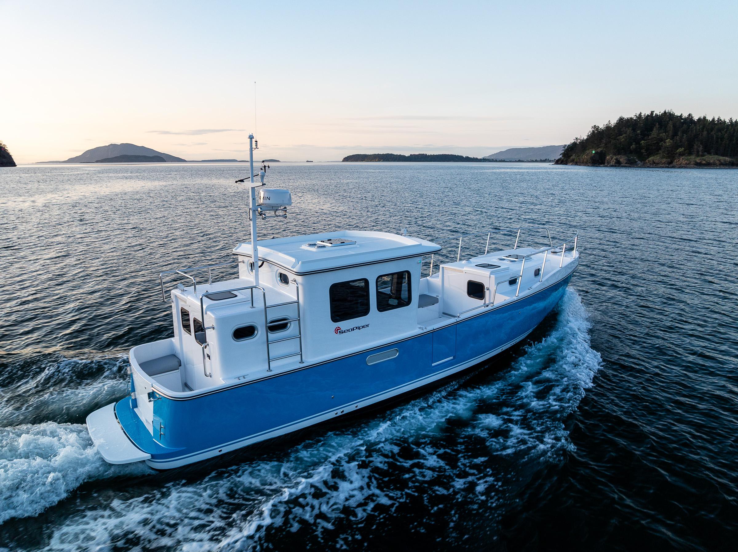 2025 SeaPiper 37 cruising on open water at sunset, showcasing sleek design and performance.