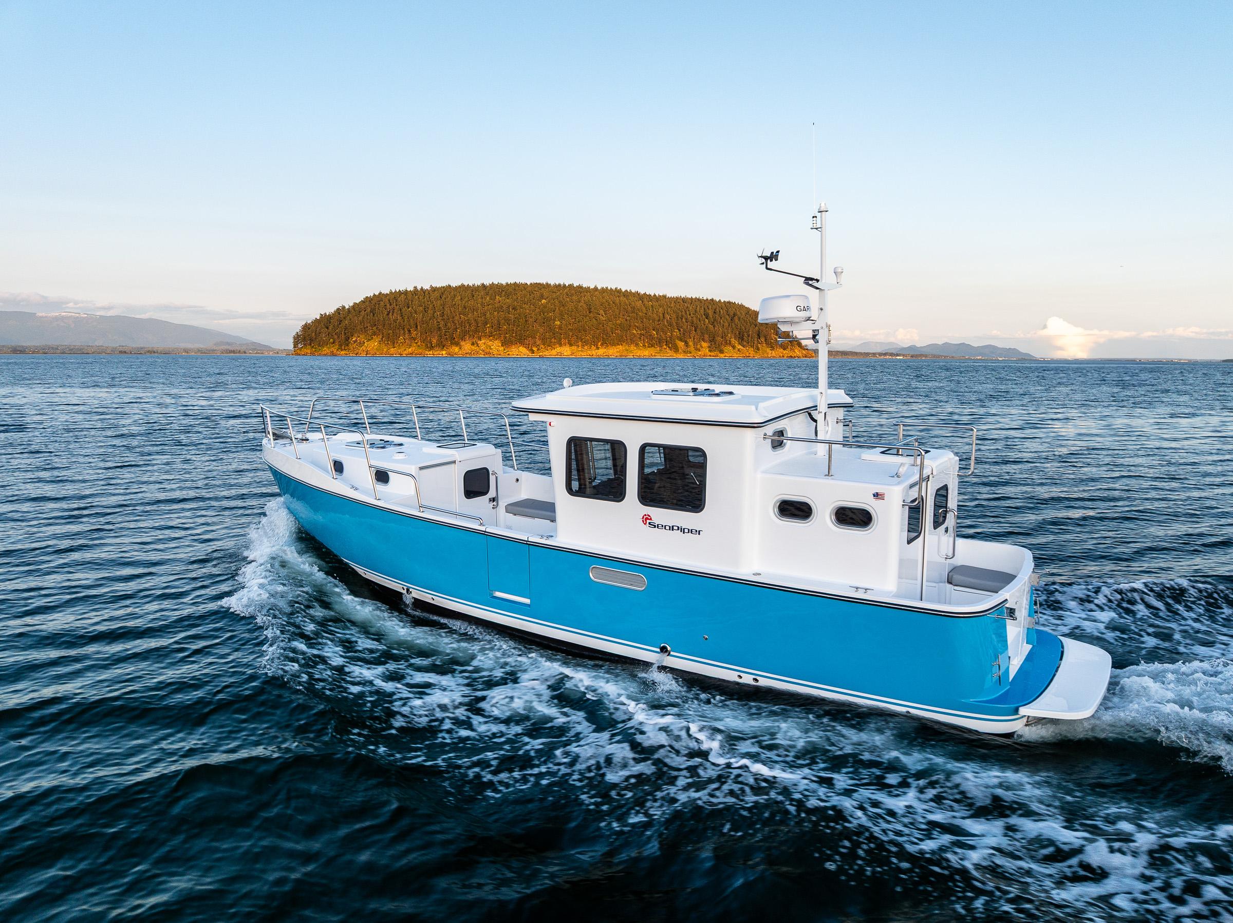 2025 SeaPiper 37 boat cruising on open water with island in background.