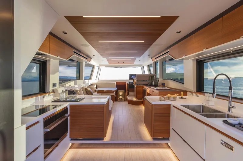 Dolce Vita Yacht Photos Pics Luxurious interior of 2024 Pardo Yachts Endurance 60, featuring modern kitchen and panoramic windows.