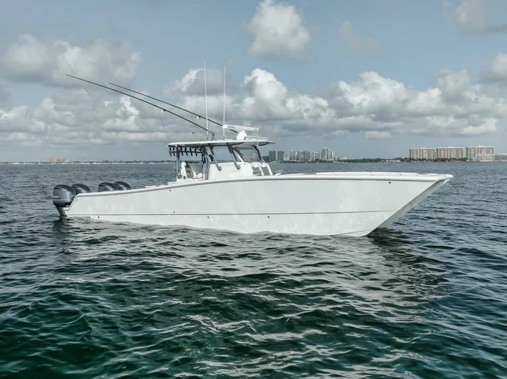 Due East Yacht Photos Pics 2017 Freeman 42LR boat on open water under cloudy sky.