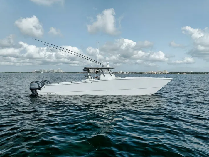 Due East Yacht Photos Pics 2017 Freeman 42LR boat on open water under a partly cloudy sky.