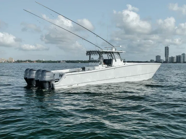 Due East Yacht Photos Pics 2017 Freeman 42LR boat on water with city skyline in background.