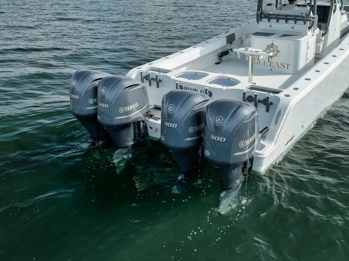 Due East Yacht Photos Pics 2017 Freeman 42LR boat with four Yamaha 300 outboard engines on water.