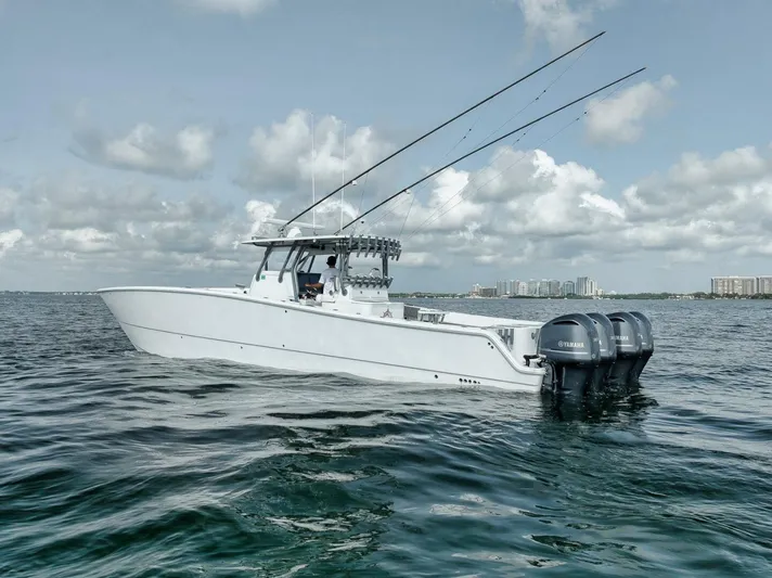 Due East Yacht Photos Pics 2017 Freeman 42LR boat on water with fishing rods and Yamaha engines.