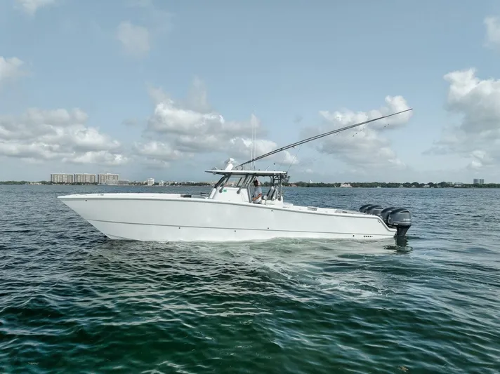 Due East Yacht Photos Pics 2017 Freeman 42LR boat cruising on open water under a clear sky.