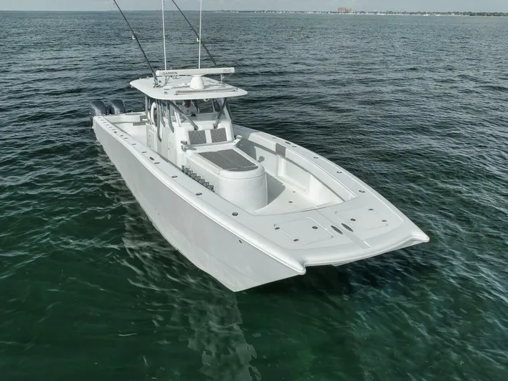 Due East Yacht Photos Pics 2017 Freeman 42LR boat on open water, showcasing sleek design and spacious deck.