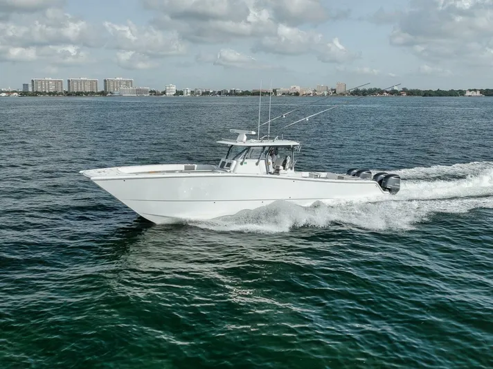 Due East Yacht Photos Pics 2017 Freeman 42LR boat cruising on open water under a cloudy sky.
