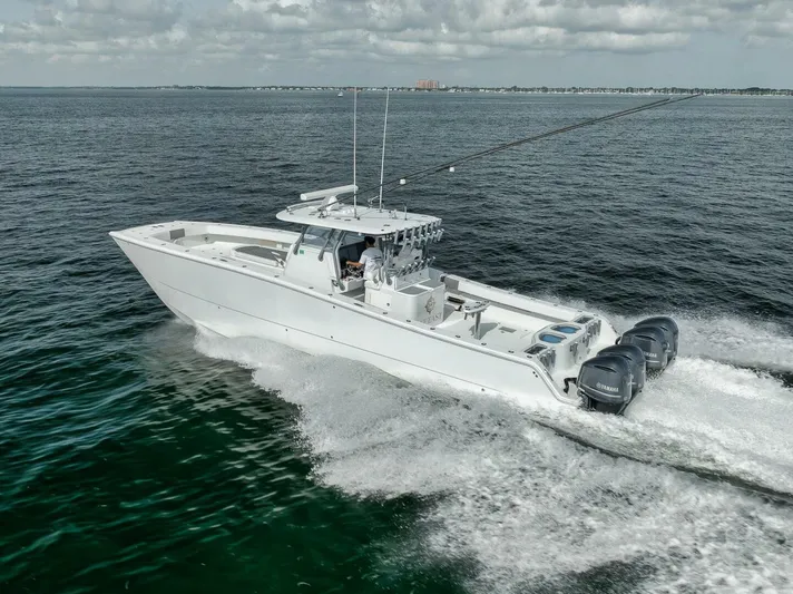 Due East Yacht Photos Pics 2017 Freeman 42LR boat cruising on open water with four engines.