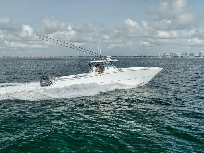 Due East Yacht Photos Pics 2017 Freeman 42LR boat cruising on open water under cloudy skies.