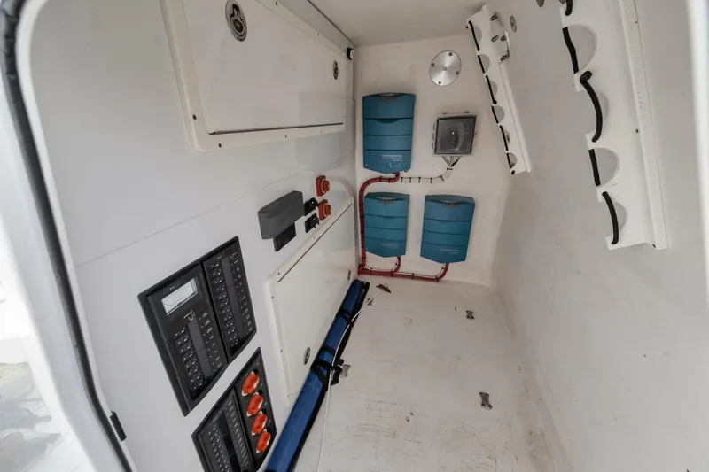 Due East Yacht Photos Pics Interior of a 2017 Freeman 42LR boat showing electrical panels and storage compartments.