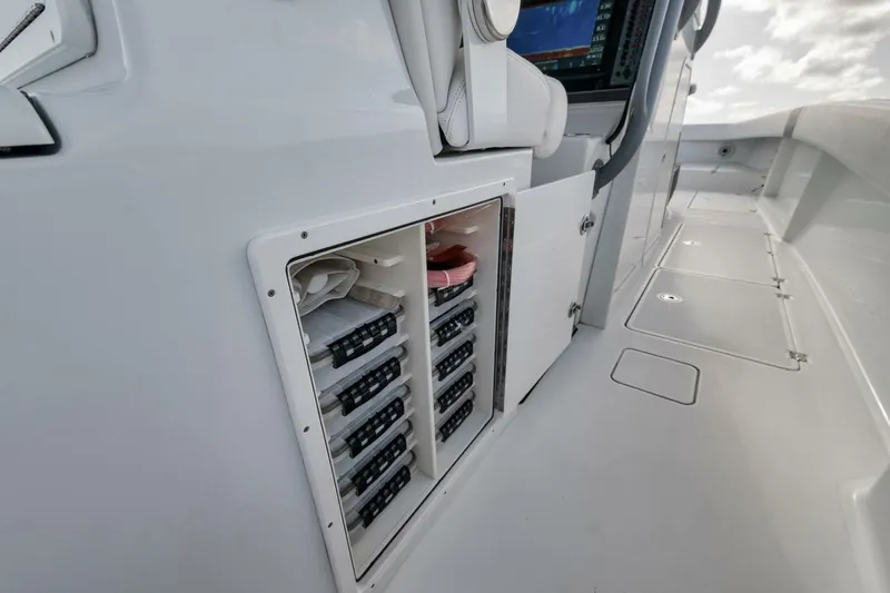 Due East Yacht Photos Pics Electrical panel on a 2017 Freeman 42LR boat, showcasing organized wiring and controls.