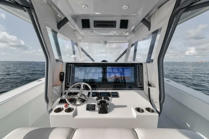 Due East Yacht Photos Pics Cockpit of 2017 Freeman 42LR boat with advanced navigation system on open water.