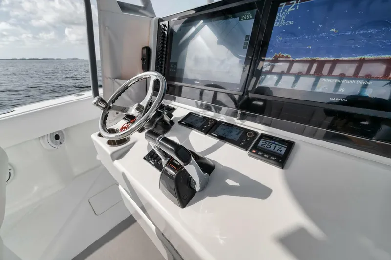 Due East Yacht Photos Pics Helm of 2017 Freeman 42LR boat with advanced navigation displays and controls.