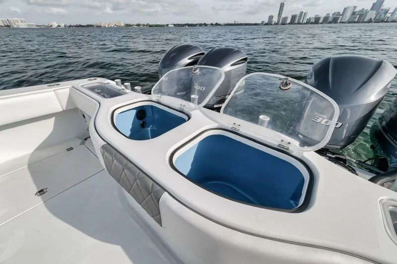 Due East Yacht Photos Pics Freeman 42LR 2017 boat with open compartments and powerful engines on a calm sea.