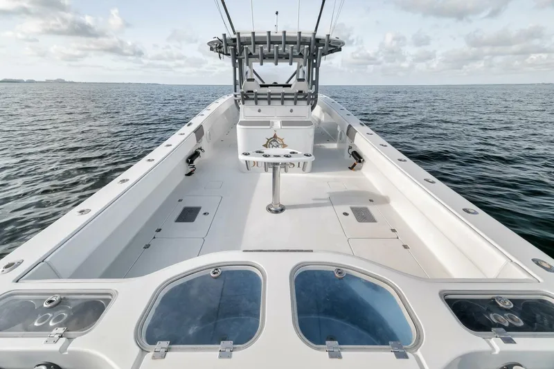 Due East Yacht Photos Pics 2017 Freeman 42LR boat on open water, showcasing spacious deck and helm.