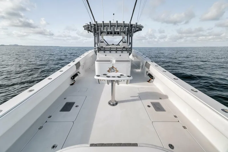 Due East Yacht Photos Pics 2017 Freeman 42LR boat on open water, showcasing spacious deck and fishing setup.