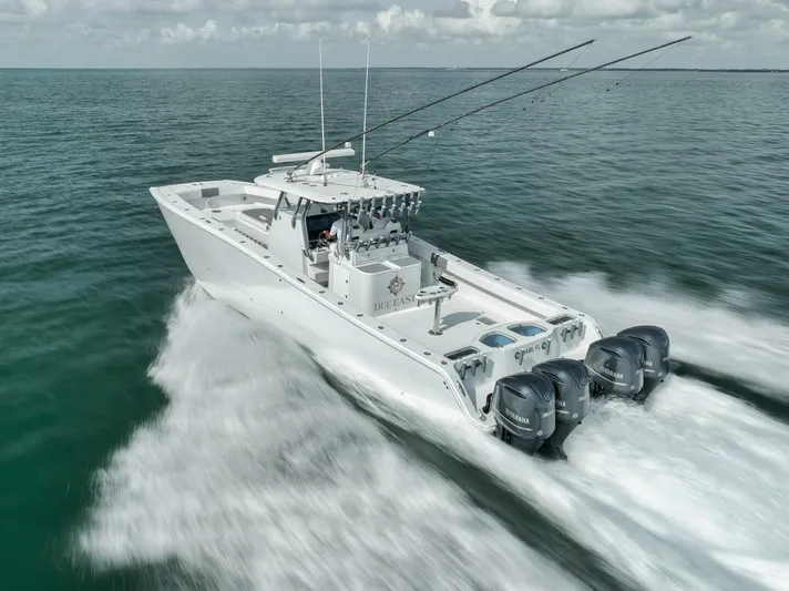 Due East Yacht Photos Pics Freeman 42LR 2017 boat speeding on open water with fishing rods and outboard motors.