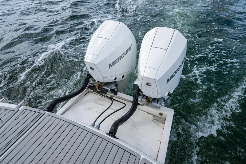 Xuru Yacht Photos Pics Twin Mercury outboard engines on a 2023 NX 340 boat, navigating through water.