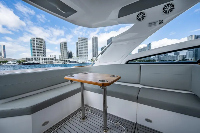 Xuru Yacht Photos Pics Luxurious 2023 NX 340 yacht interior with city skyline view.