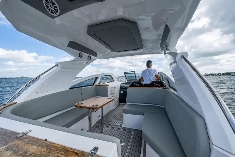 Xuru Yacht Photos Pics Luxurious 2023 NX 340 yacht interior with modern seating and ocean view.