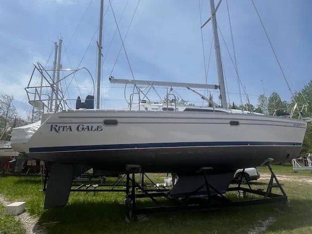 Rita Gale Yacht Photos Pics 2012 Catalina 355 sailboat on a stand, named "Rita Gale," in a grassy area.