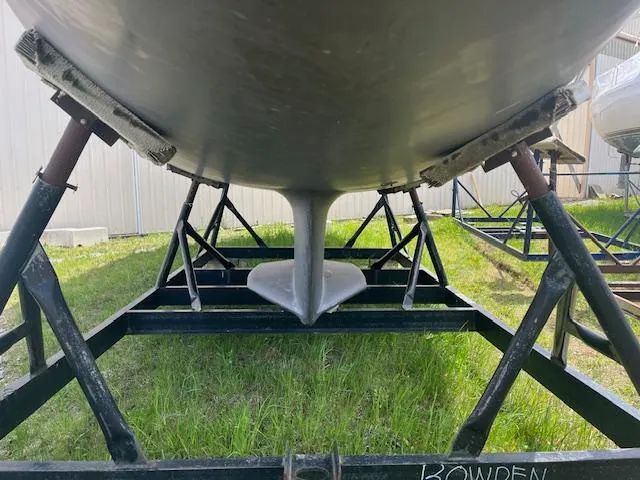 Rita Gale Yacht Photos Pics Underneath view of a 2012 Catalina 355 sailboat on a metal stand.