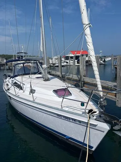 Rita Gale Yacht Photos Pics 2012 Catalina 355 sailboat docked at marina under clear blue sky.