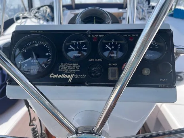 Rita Gale Yacht Photos Pics Control panel of a 2012 Catalina 355 yacht with gauges and steering wheel.