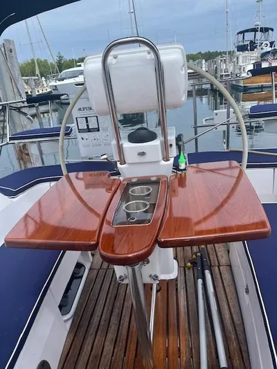 Rita Gale Yacht Photos Pics Cockpit of 2012 Catalina 355 sailboat with wooden table and steering wheel.